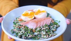 Wood-fired smoked salmon salad with olives, kipflers, soft-boiled egg, and dukkah.